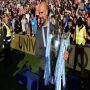 •Photo shows Manchester City manager Pep Guardiola with the Premier League trophy